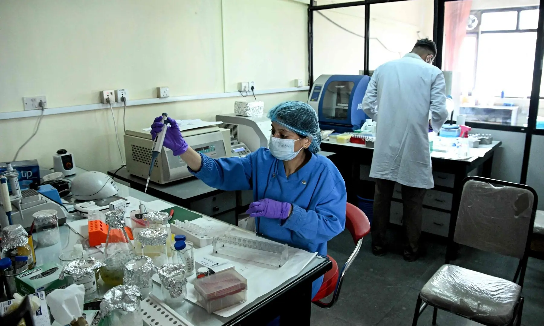 Forensic analysts conduct DNA testing to help identify missing flash flood victims at the National Forensic Science Laboratory in Lalitpur on September 19, 2026. —AFP/File