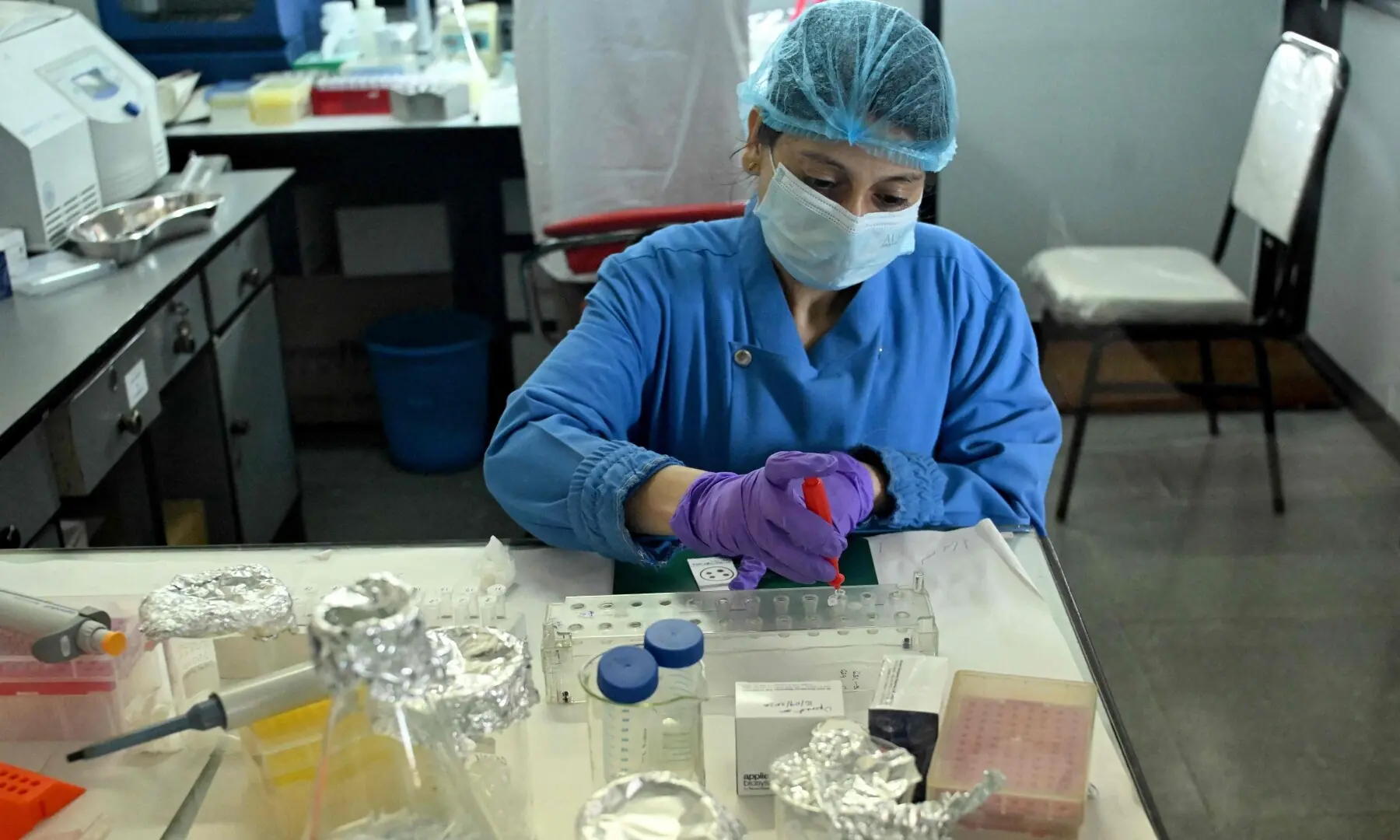 A forensic analyst conducts DNA testing to help identify missing flash flood victims at the National Forensic Science Laboratory in Lalitpur on September 19, 2026. —AFP/File
