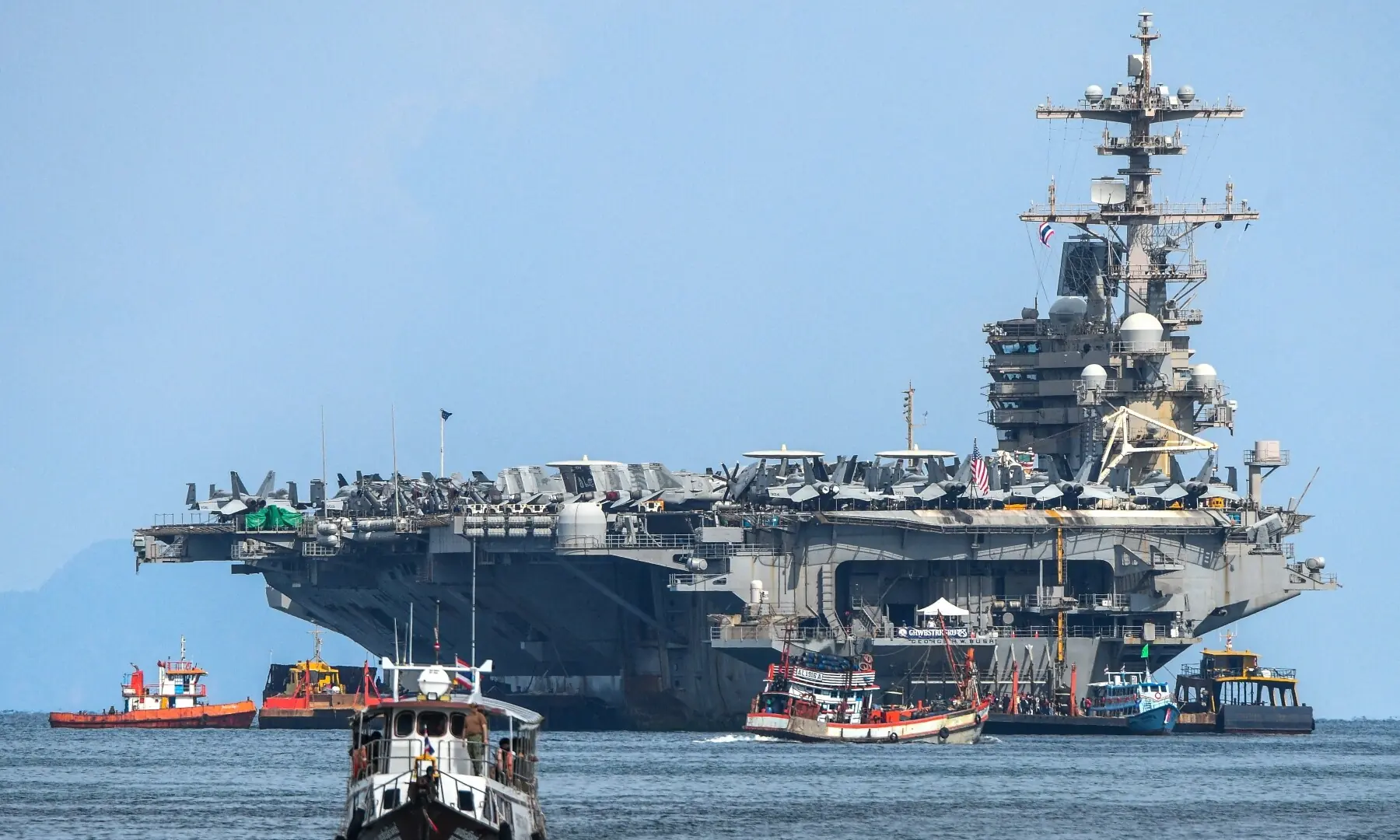 A ferry carries Marines from the USS George H.W. Bush to a pier near Phuket Deep Sea Port during a rest stop following a long deployment in the Middle East, in Phuket, Thailand on October 4, 2026. &mdash; Reuters