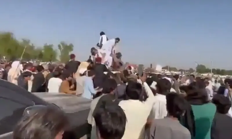 A crowd of PTI supporters surrounds Khyber Pakhtunkhwa Chief Minister Sohail Afridi's convoy in Lakki Marwat on October 4, 2026. &mdash; Screengrab via X/@PTIofficial