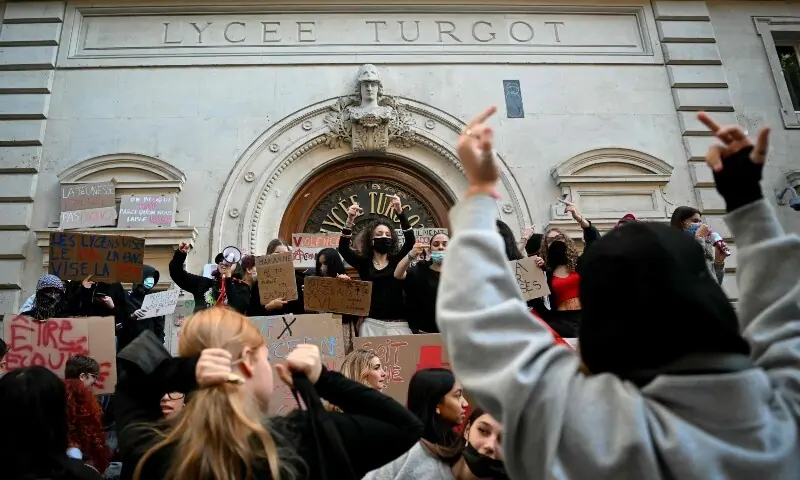 Protesting students gather and hold placards as they carry out a blockading action at the Turgot secondary school, in Paris, on October 5, 2026. — AFP Protesting students gather and hold placards as they carry out a blockading action at the Turgot secondary school, in Paris, on October 5, 2026. — AFP