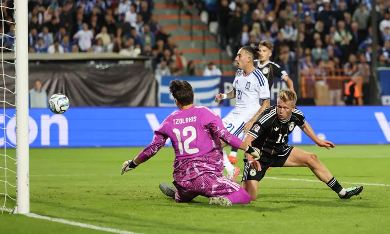 THESSALONIKI (Greece): Germany’s Jonathan Burkardt (R) scores a goal that was later disallowed during the Nations League Group A2 match against Greece at the Toumba Stadium.—Reuters THESSALONIKI (Greece): Germany’s Jonathan Burkardt (R) scores a goal that was later disallowed during the Nations League Group A2 match against Greece at the Toumba Stadium.—Reuters