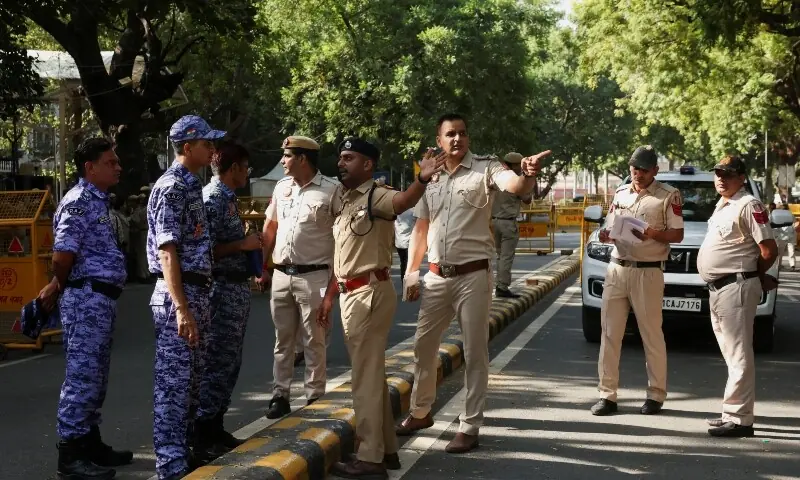Members of the Rapid Action Force (RAF), along with police officers, stand next to barricades as they prepare for a protest organised by opposition parties demanding the resignation of Chief Election Commissioner Gyanesh Kumar near Parliament in New Delhi, India, October 6, 2026. &mdash;Reuters