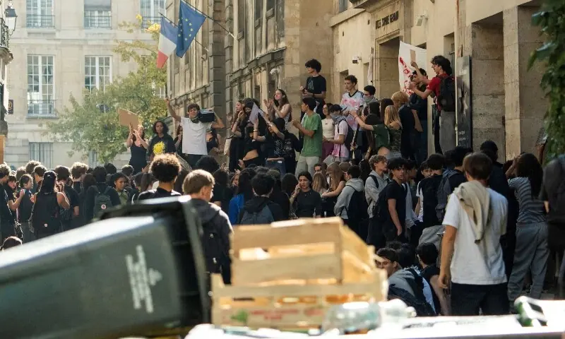 French high school students gather outside the Lycee Charles Peguy high school in Paris as part of a nationwide day of demonstrations and blockades,  France, October 6, 2026. &mdash;Reuters