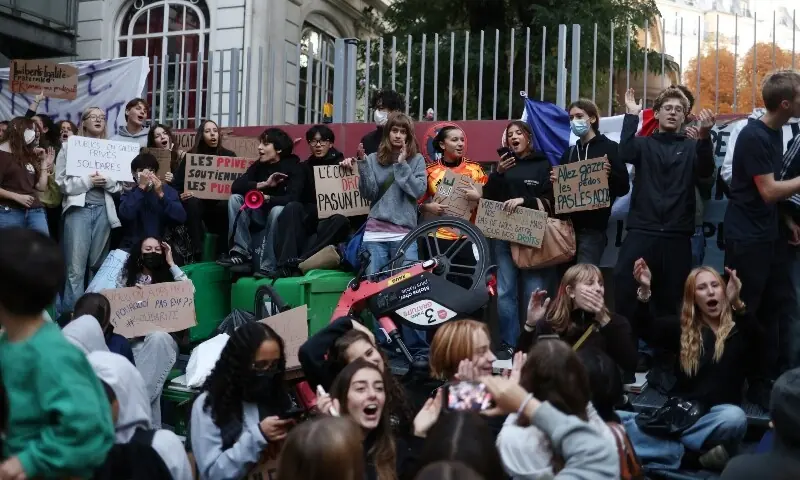 French high school students gather outside the Lycee Charles Peguy high school in Paris as part of a nationwide day of demonstrations and blockades, voicing anger over overcrowded classrooms, teacher shortages and dilapidated school buildings, which students blame on years of underinvestment, France, October 6, 2026. &mdash;Reuters