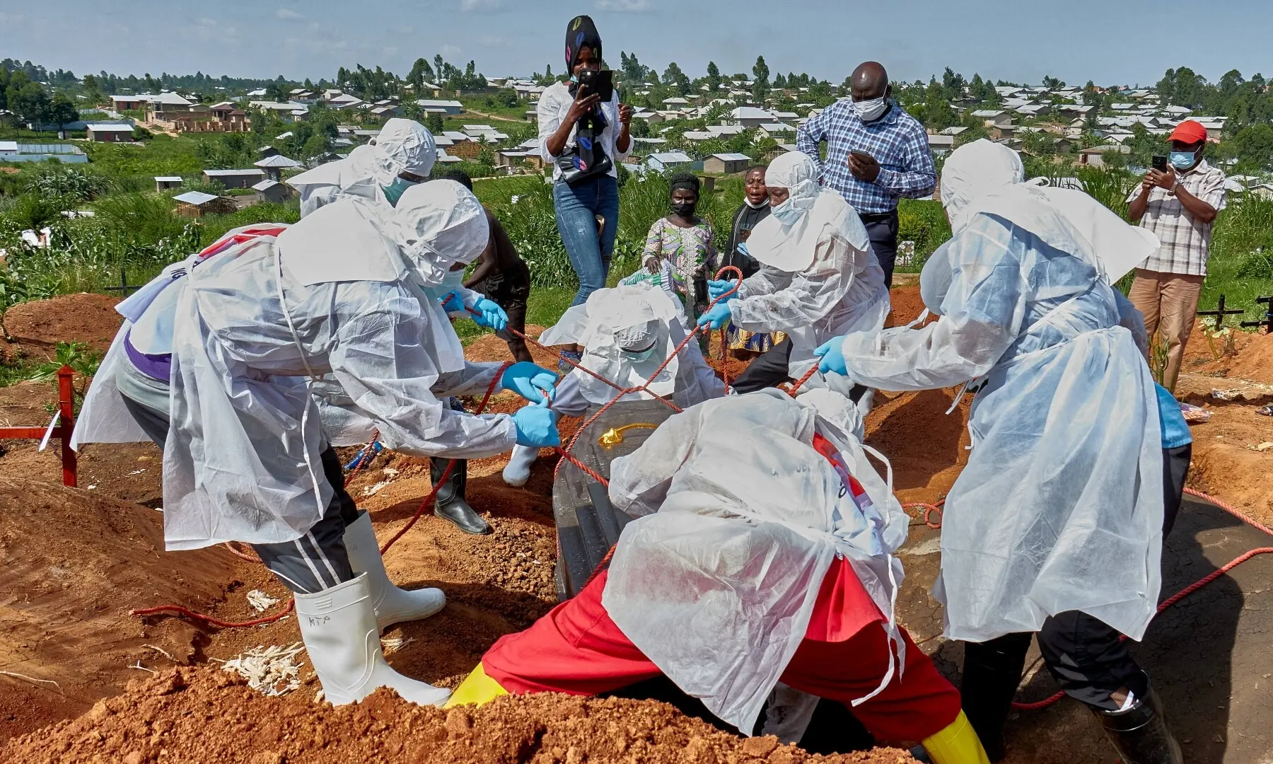 Red Cross workers wearing personal protective equipment (PPE) lower the coffin of Dr Tibenderana Katho Blaise who worked at the Centre Medical Evangelique (CME) in Hoho commune and died of Ebola virus, as aid agencies intensify efforts to contain a new Ebola outbreak caused by the Bundibugyo virus, at the Nyamurongo cemetery in Bunia town, Ituri province, Democratic Republic of Congo on May 26, 2026. —Reuters/File