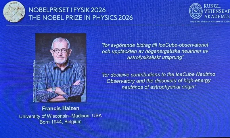 A photograph of Francis Halzen is displayed on a screen as he is named the recipient of the 2026 Nobel Prize in Physics during a press conference at the Royal Swedish Academy of Sciences in Stockholm, Sweden, on October 6, 2026. &mdash; AFP