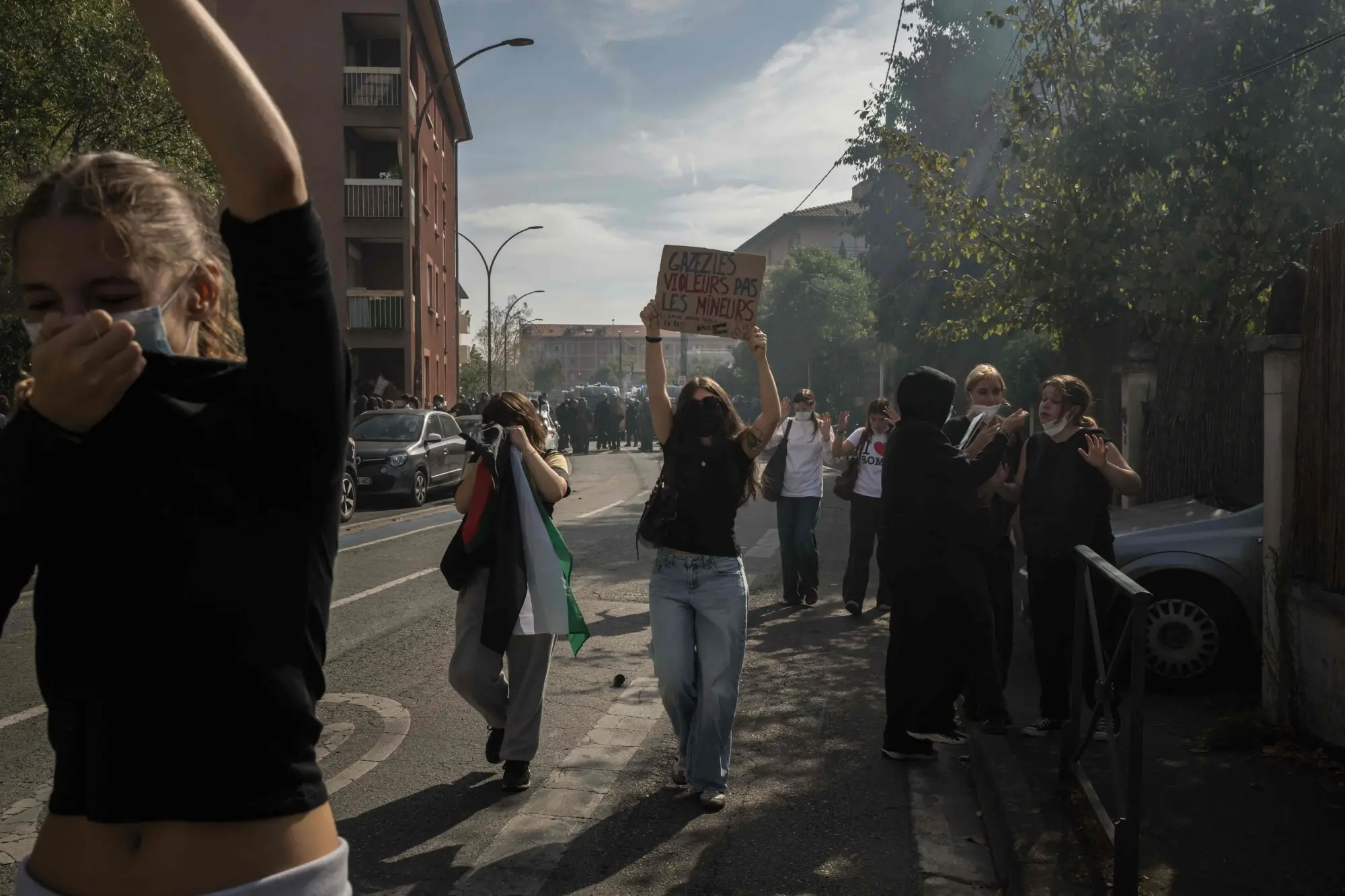 Protesters retreat from tear gas fired by riot police during a demonstration of high-school students as part of a nationwide protest movement over learning conditions in Toulouse, on October 6, 2026. — AFP