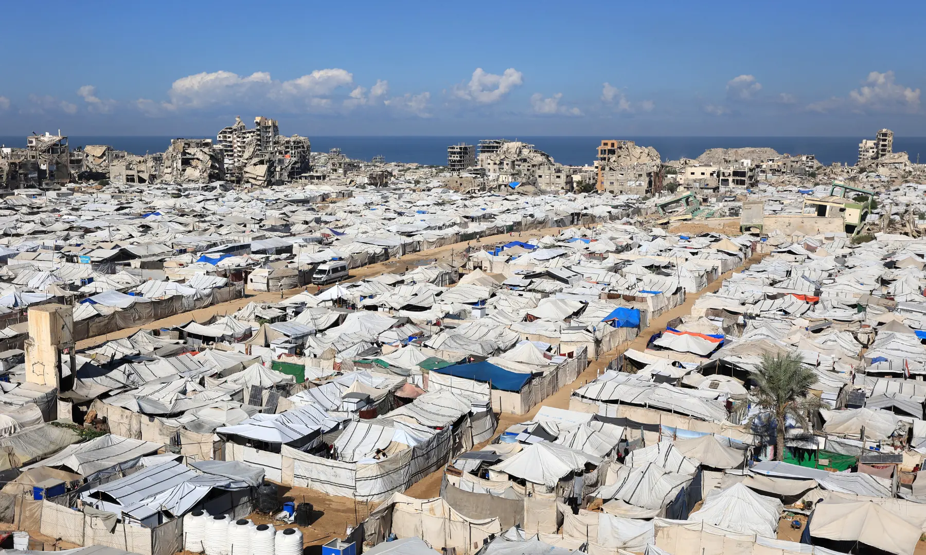 A view of the temporary tents of displaced Palestinians is pictured along destroyed buildings in Gaza City on Oct 7, 2026. &mdash; AFP