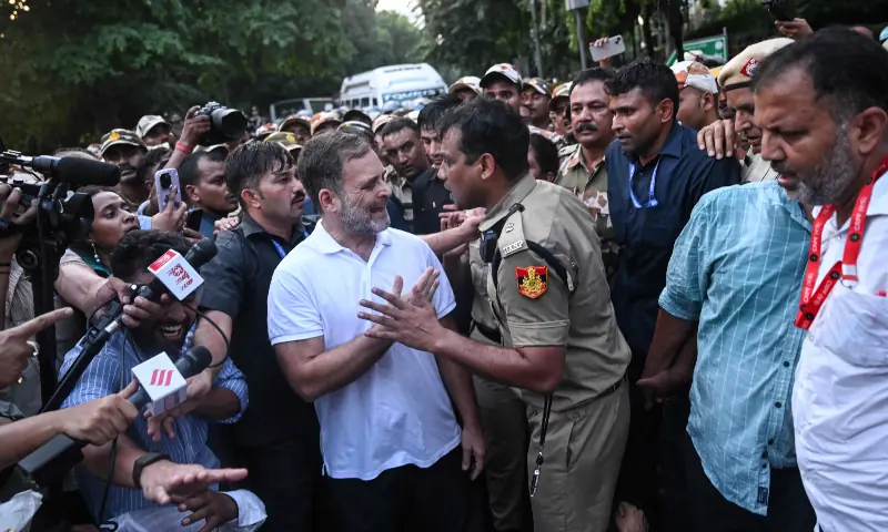 India’s Opposition Leader Rahul Gandhi (centre, L) scuffles with a policeman during a protest by the opposition alliance INDIA bloc in New Delhi on October 7, 2026 against the country’s Chief Election Commissioner Gyanesh Kumar, calling for his resignation over alleged irregularities in the Special Intensive Revision (SIR) of electoral rolls. — AFP