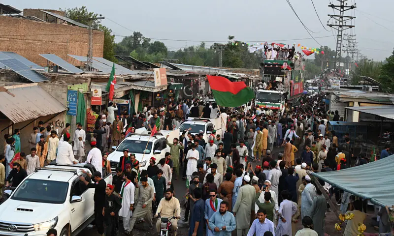 participants of the PTI’s long march pass through Khyber district.—Abdul Majeed Goraya participants of the PTI’s long march pass through Khyber district.—Abdul Majeed Goraya