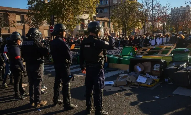 Police officers stand guard as French high school students block the road outside Lycee Helene-Boucher high school, as part of nationwide protests to demand better school conditions in Paris, France, October 8, 2026. —Reuters