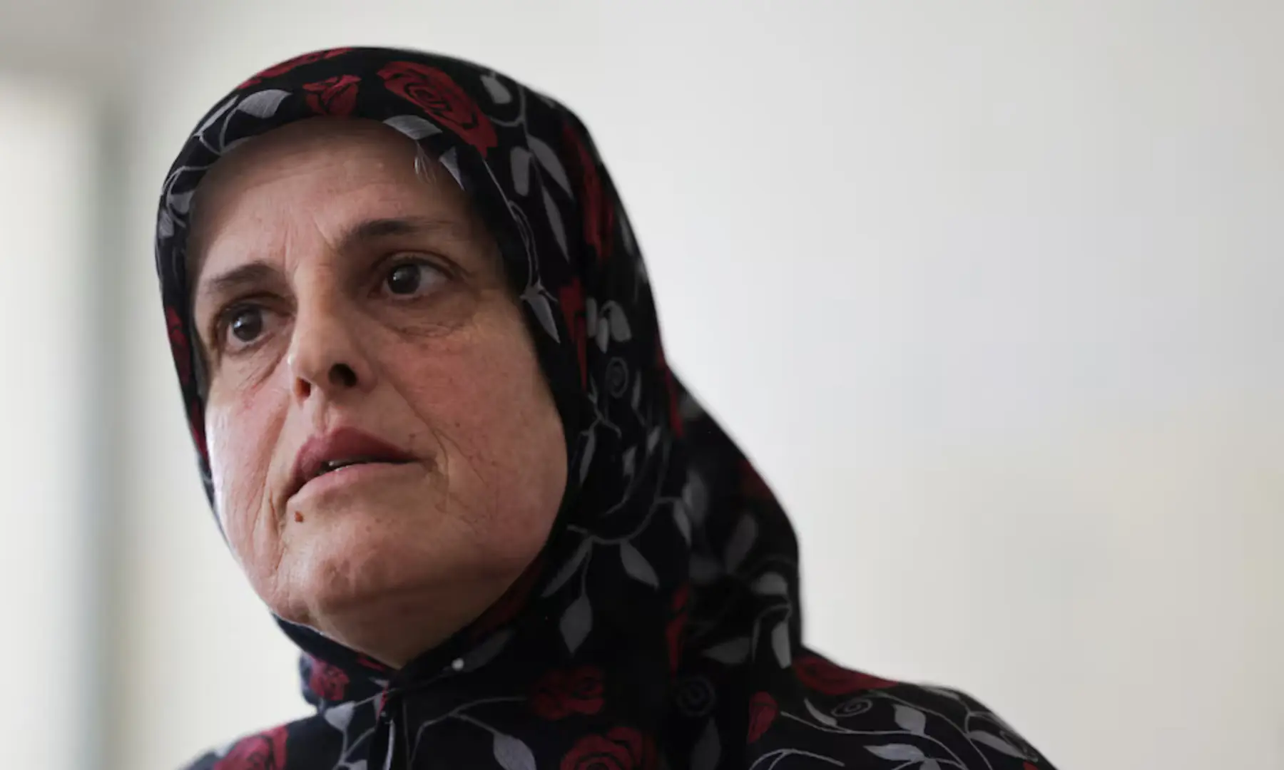 Displaced resident of Zawtar al-Gharbiyeh, Zeinab Loubani, 54, reacts during an interview with Reuters at a school turned into a shelter for displaced families, in Sidon, Lebanon, on July 23, 2026. — Reuters
