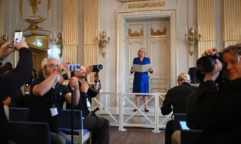 The Permanent Secretary of the Swedish Academy Ingrid Carlberg (C) gives a press conference to announce the winner of the 2026 Nobel Prize in Literature at the Swedish Academy in Stockholm, Sweden, on October 8, 2026. &mdash;AFP