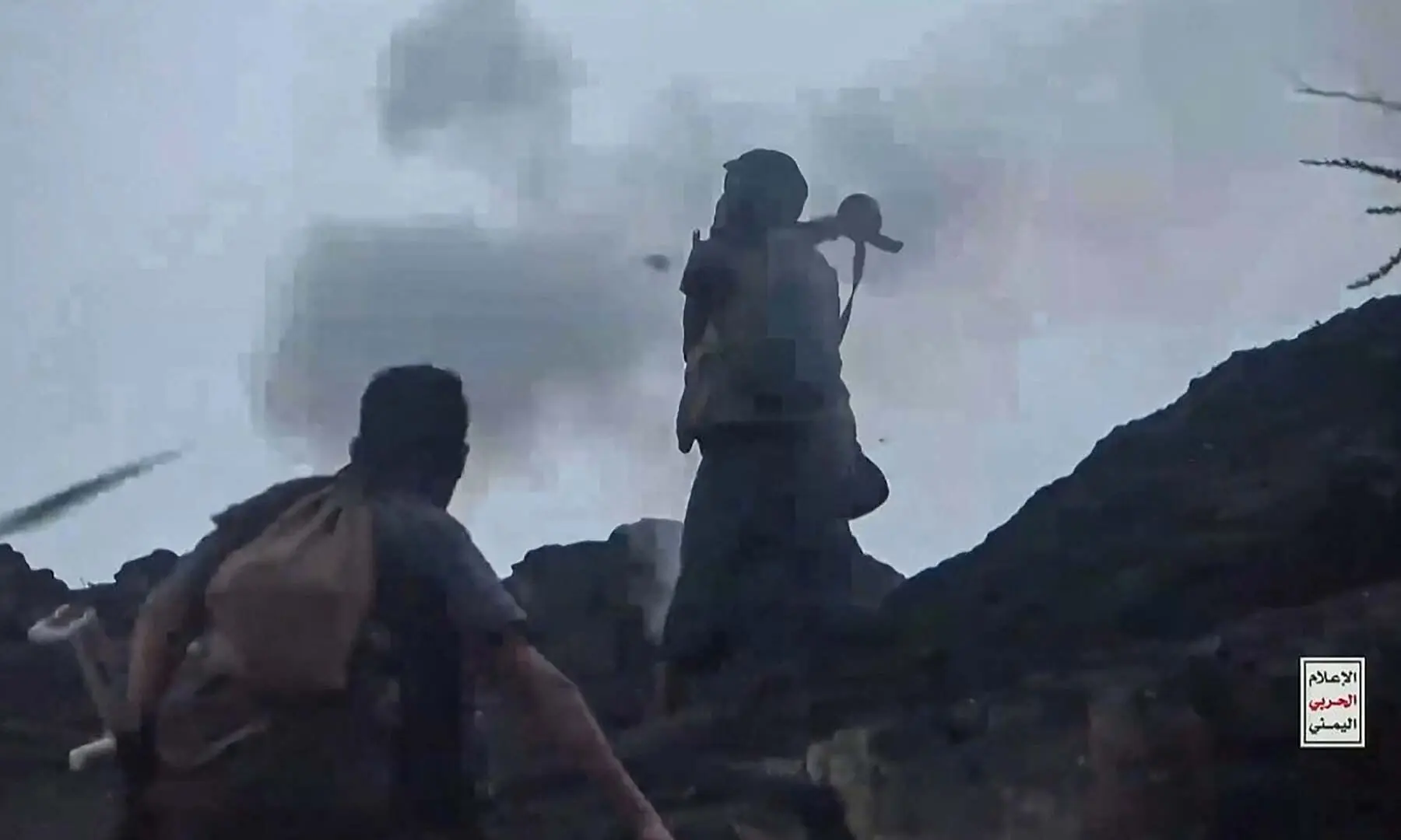 This screen grab taken from video footage released by Ansarullah Media Centre on October 7, 2026 shows a fighter affiliated with the Houthi rebels firing a rocket-propelled grenade launcher as they advance against Saudi-led Yemeni government troops in the Taiz Governorate. &mdash; AFP
