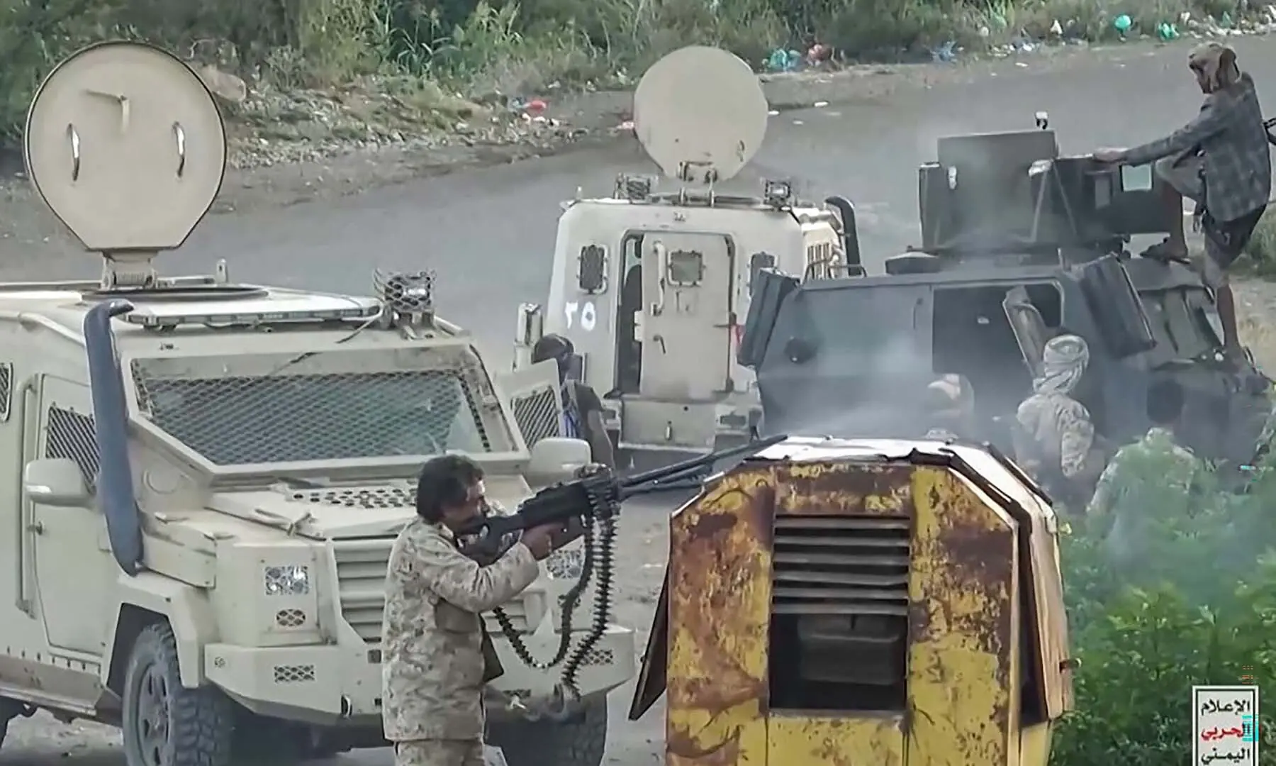 This screen grab taken from video footage released by Ansarullah Media Centre on October 7, 2026 shows a fighter affiliated with the Houthi rebels firing his machine gun as they advance against Saudi-led Yemeni government troops in the Taiz Governorate. &mdash; AFP