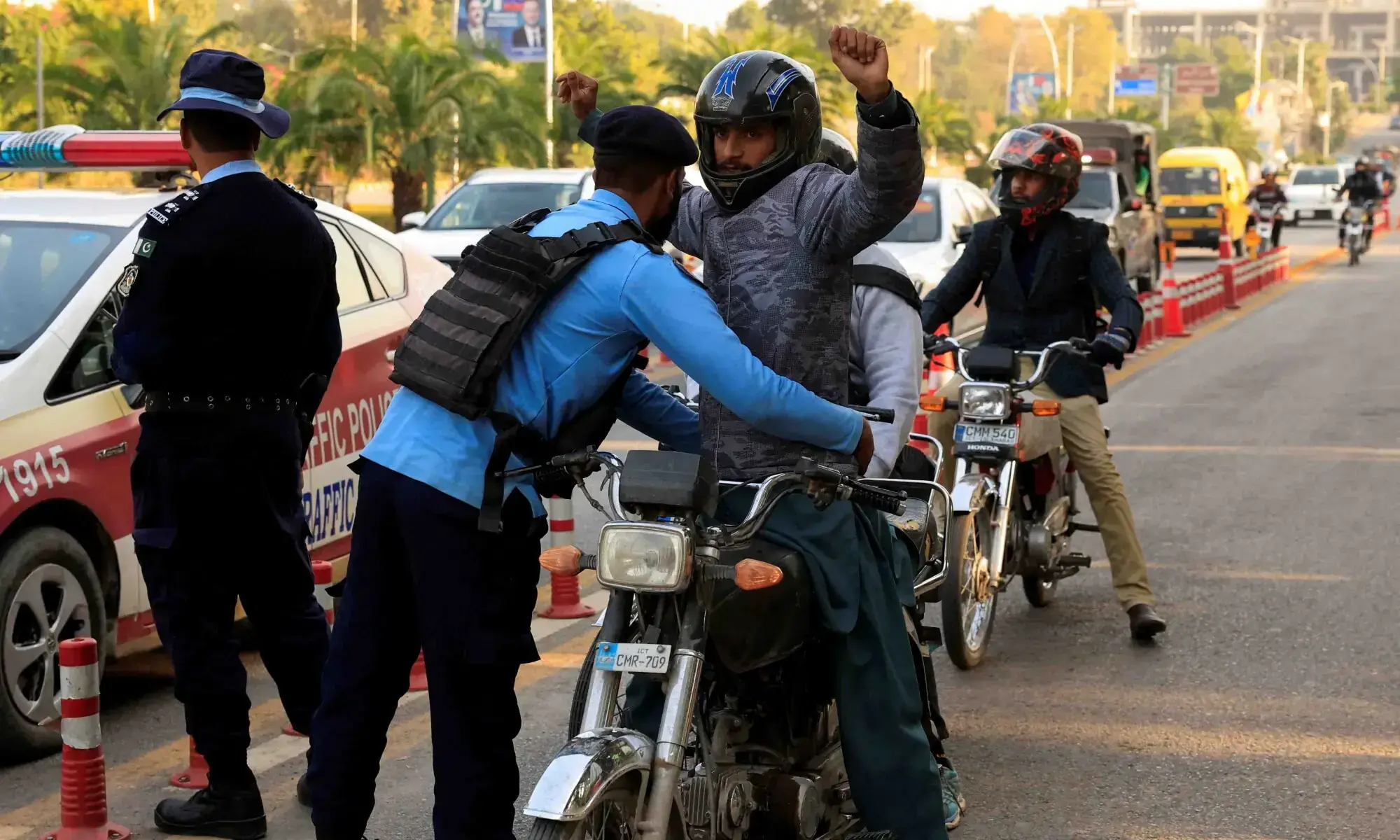 A police officer frisks a biker at a security check in Islamabad on November 12, 2025.— Reuters/File A police officer frisks a biker at a security check in Islamabad on November 12, 2025.— Reuters/File