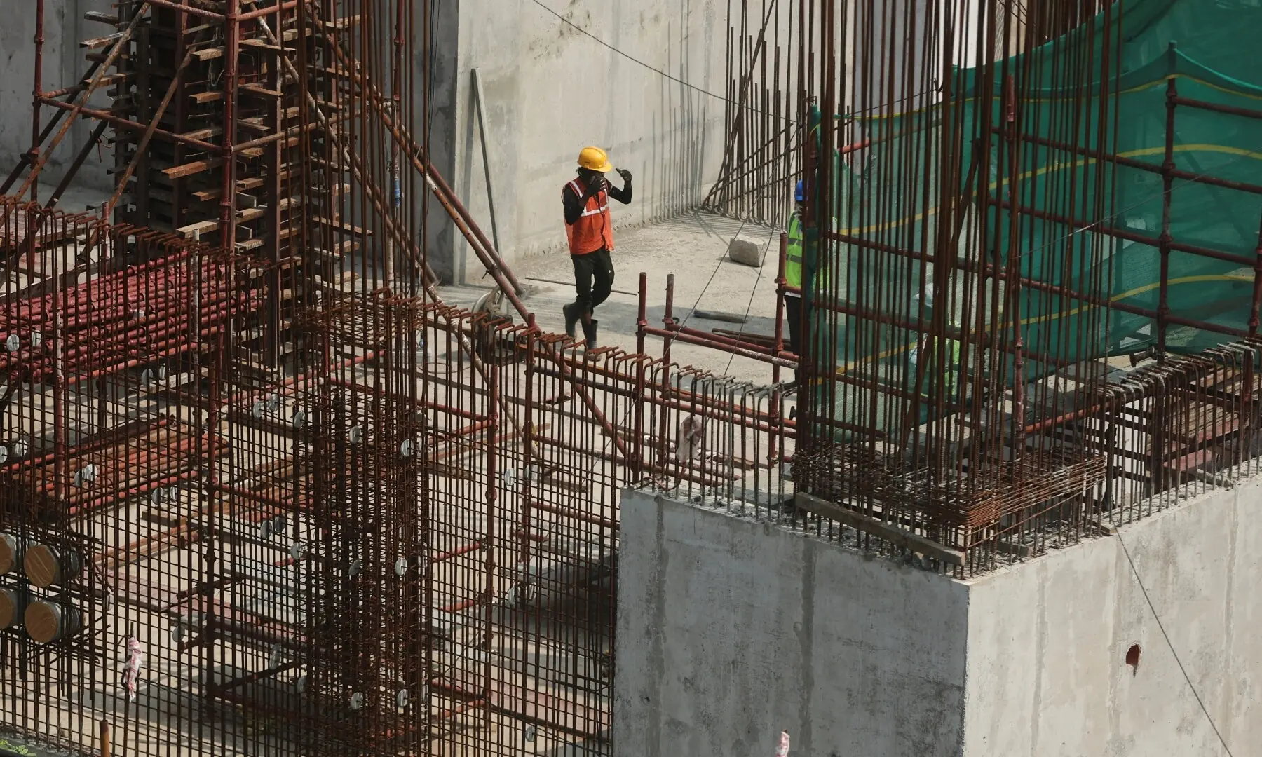 A worker walks at the construction site of an Amazon data centre in Thane, India on September 30, 2026. —Reuters