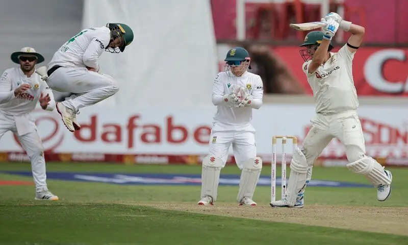 South Africa's Ryan Rickelton (second L) jumps to field a ball played by Australian captain Pat Cummins during the first Test at the Kingsmead Stadium in Durban on October 9, 2026. —AFP South Africa's Ryan Rickelton (second L) jumps to field a ball played by Australian captain Pat Cummins during the first Test at the Kingsmead Stadium in Durban on October 9, 2026. —AFP