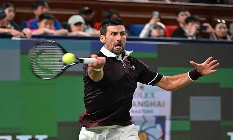 Serbia's Novak Djokovic hits a return against Poland's Hubert Hurkacz during their Shanghai Masters round-of-64 match at the Qizhong Forest Sports City Arena in Shanghai on October 9, 2026. &mdash;AFP