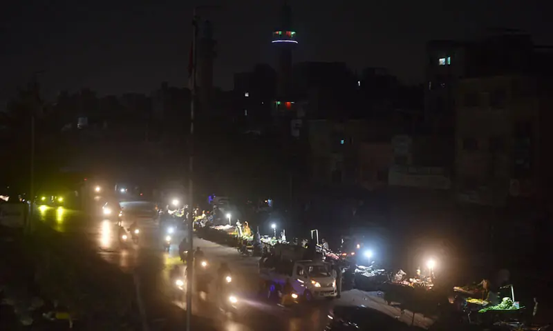 The area of Liaquatabad plunges into darkness due to loadshedding.—Fahim Siddiqi / White Star The area of Liaquatabad plunges into darkness due to loadshedding.—Fahim Siddiqi / White Star