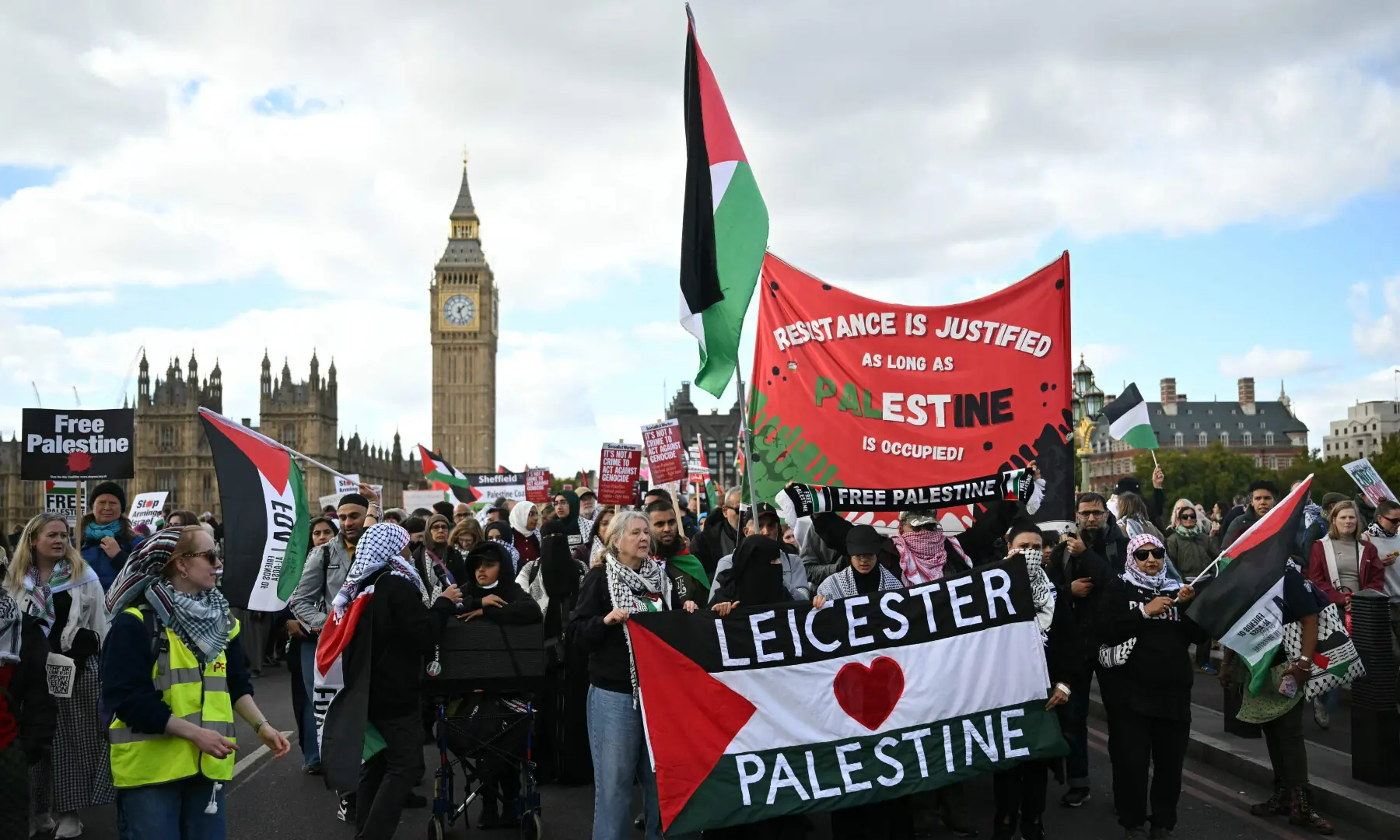 People cross Westminster Bridge with banners as they take part in a National March in support of Palestine, organised by Palestine Solidarity Campaign, in central London on Oct 10, 2026. — AFP