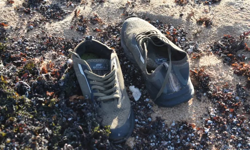 A pair of shoes believed to belong to a migrant lies on the shore after a boat carrying about 305 people capsized while sailing from Djibouti to Yemen, according to the United Nations’ International Organisation for Migration on October 11, near Guhere, north of the port town of Obock, Djibouti, in this photograph released on October 10, 2026. — AFP