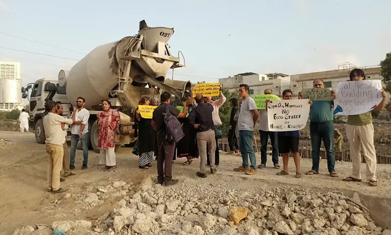 Protesters gather at Nehr-i-Khayam in Clifton, demanding a stop to the ongoing construction work.—Photo by the writer Protesters gather at Nehr-i-Khayam in Clifton, demanding a stop to the ongoing construction work.—Photo by the writer