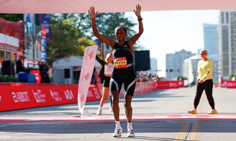 Ethiopia's Hawi Feysa celebrates after taking the first place in the women's professional division during the Chicago Marathon in Chicago, Illinois, on October 11, 2026. —AFP Ethiopia's Hawi Feysa celebrates after taking the first place in the women's professional division during the Chicago Marathon in Chicago, Illinois, on October 11, 2026. —AFP