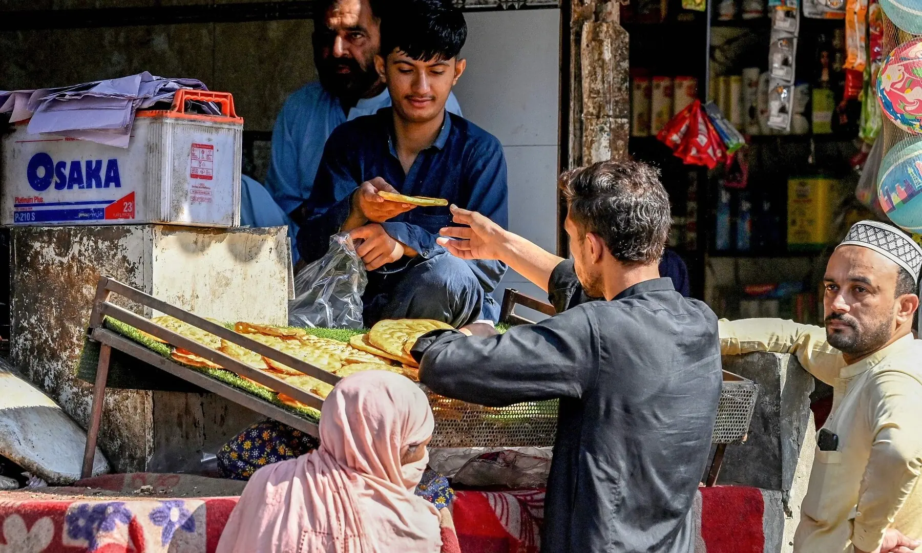 People buy breads at a bakery shop after the imposition of emergency and governor&rsquo;s rule in KP on October 12, 2026. &mdash;Reuters