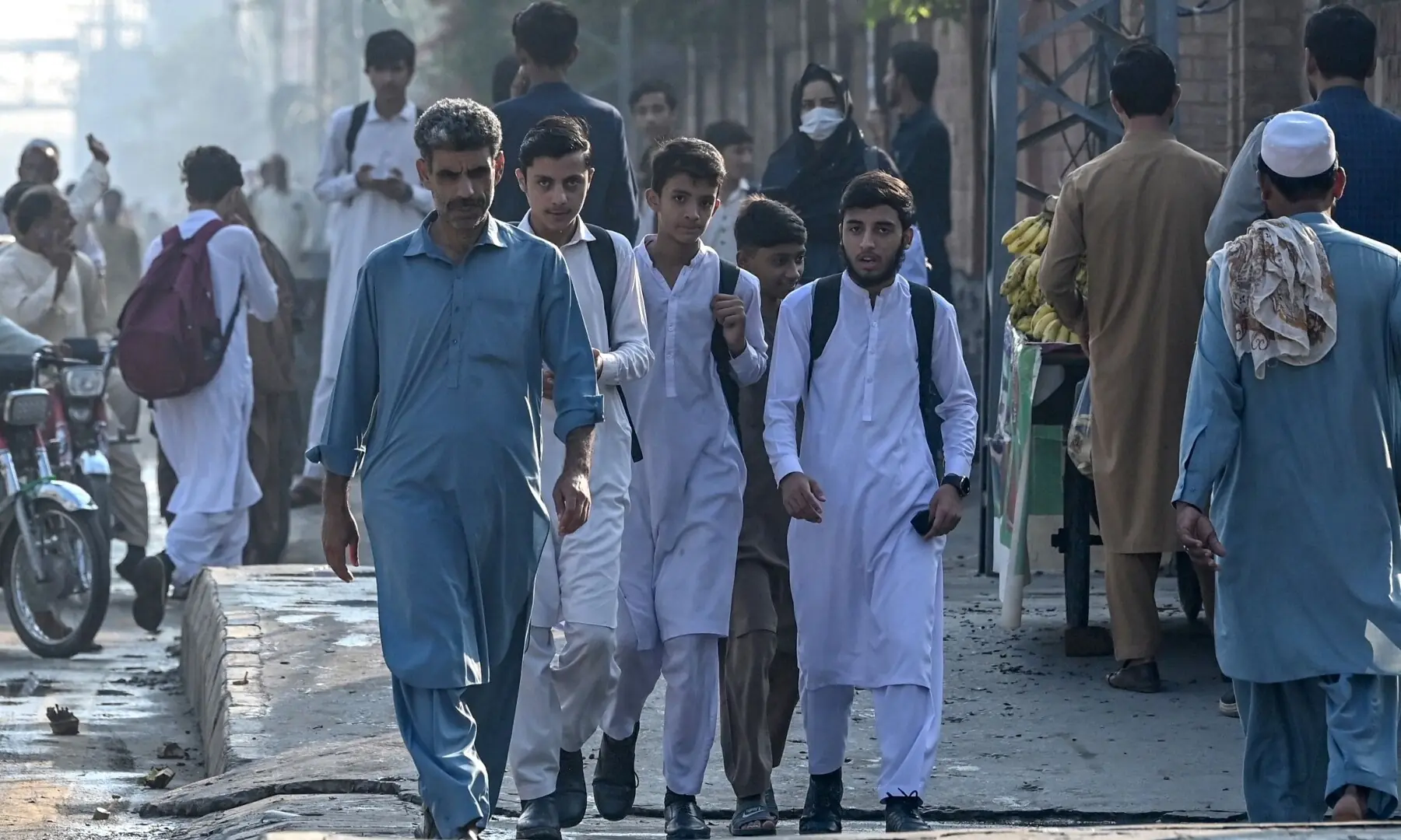 Students walk back to their homes as schools are closed after the imposition of emergency and governor&rsquo;s rule  in KP on October 12, 2026. &mdash;Reuters
