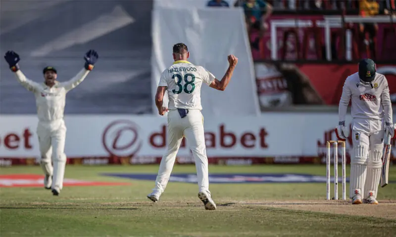 AUSTRALIAN pacer Josh Hazlewood celebrates after dismissing South African batter David Bedingham during the first Test at Kingsmead on Monday.&mdash;AFP
