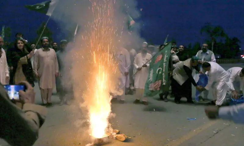 PML-N workers celebrate imposition of governor’s rule in Peshawar on Monday. — PPI PML-N workers celebrate imposition of governor’s rule in Peshawar on Monday. — PPI