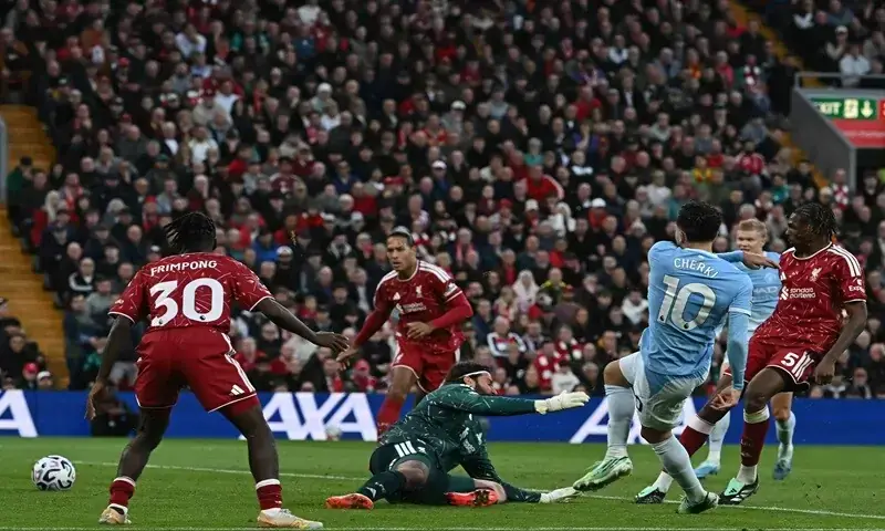 Manchester City's Rayan Cherki (second R) shoots to score past Liverpool goalkeeper Alisson during their Premier League match at Anfield in Liverpool on October 11, 2026. —AFP Manchester City's Rayan Cherki (second R) shoots to score past Liverpool goalkeeper Alisson during their Premier League match at Anfield in Liverpool on October 11, 2026. —AFP
