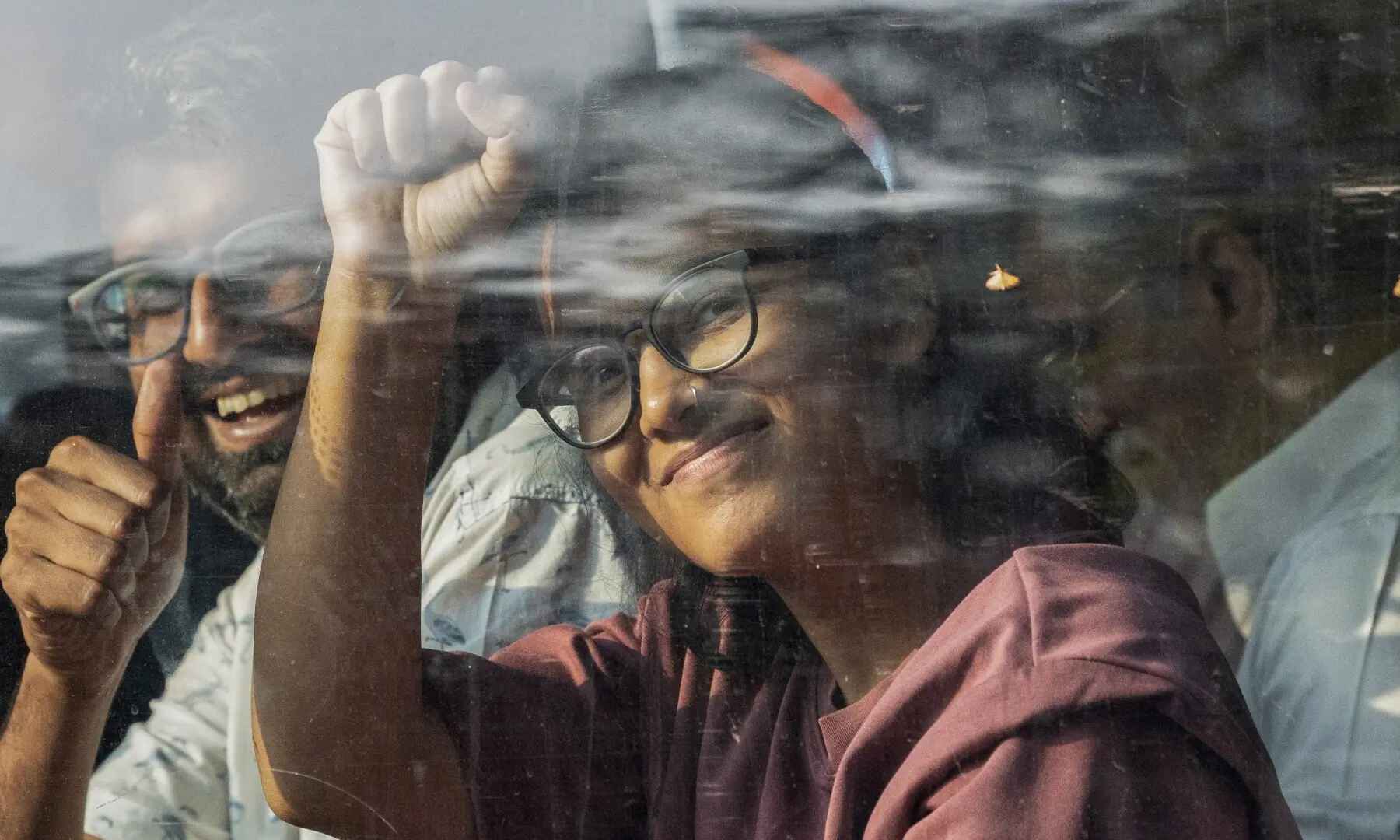 All India Students’ Association (AISA) President Neha Bora raises her fist inside a bus, as opposition parties march to the Supreme Court in protest against a controversial revision of voter lists that has sparked days of unrest, in New Delhi, India on October 12, 2026. —Reuters