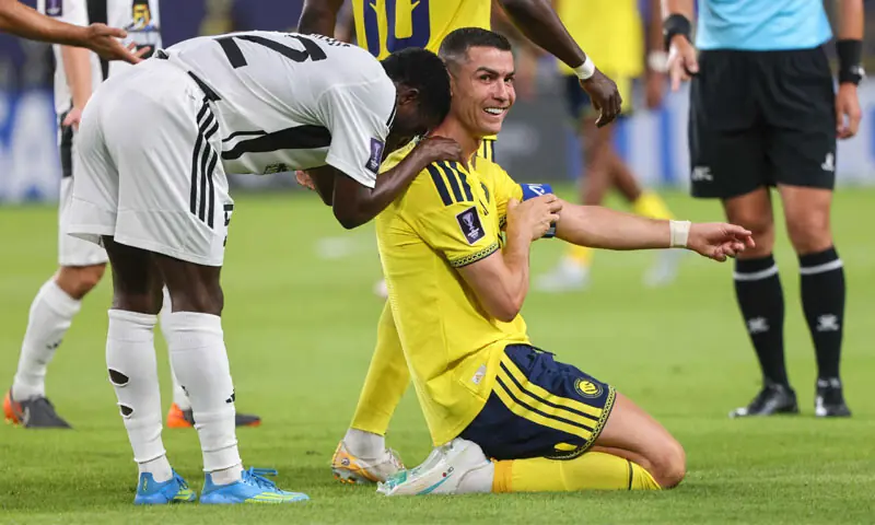 AL-NASSR&rsquo;S Cristiano Ronaldo (R) and Neftchi Fergana&rsquo;s Koffi Kouao react during their AFC Champions League Group &lsquo;B&rsquo; match at the Alawwal Park Stadium.&mdash;AFP
