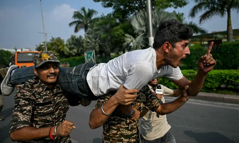 Security personnel detain a student activist during a protest demanding the resignation of Chief Election Commissioner Gyanesh Kumar.—AFP Security personnel detain a student activist during a protest demanding the resignation of Chief Election Commissioner Gyanesh Kumar.—AFP