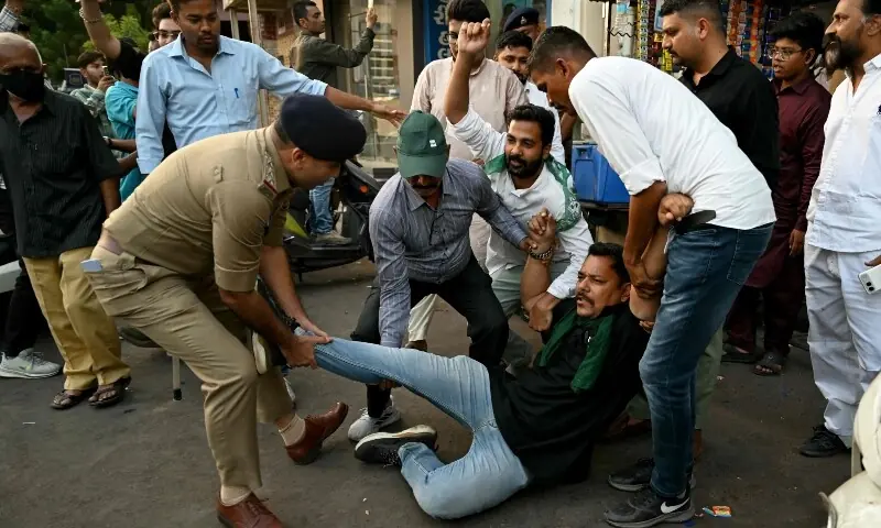 Police detain All India party supporters during a protest demanding the resignation of the country’s Chief Election Commissioner Gyanesh Kumar in Ahmedabad on October 13, 2026. —AFP