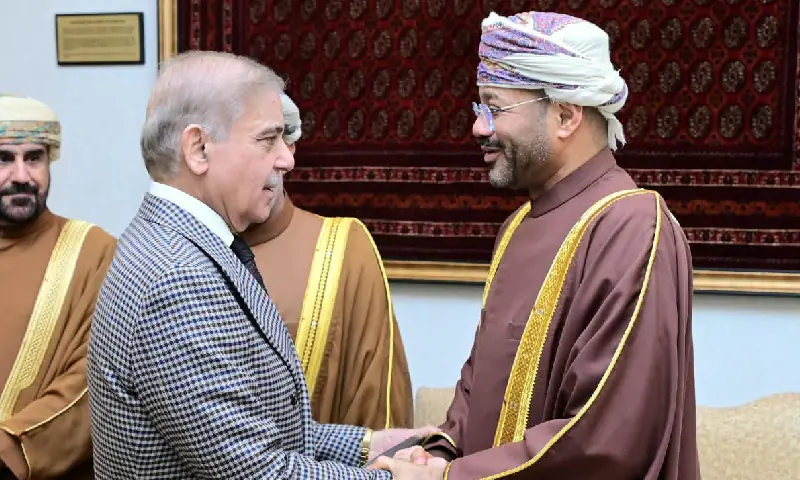 Omani Foreign Minister Sayyid Badr Albusaidi (R) shakes hands with Prime Minister Shehbaz Sharif as the two hold a meeting in Islamabad on Oct 14. &mdash; PMO/X