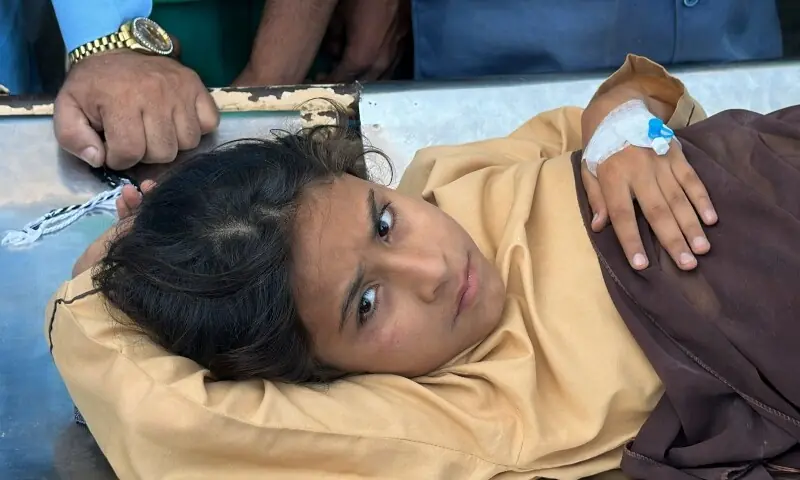 A girl who was injured after a school roof collapse receives first aid at a hospital in Peshawar October 15, 2026. &mdash;AFP