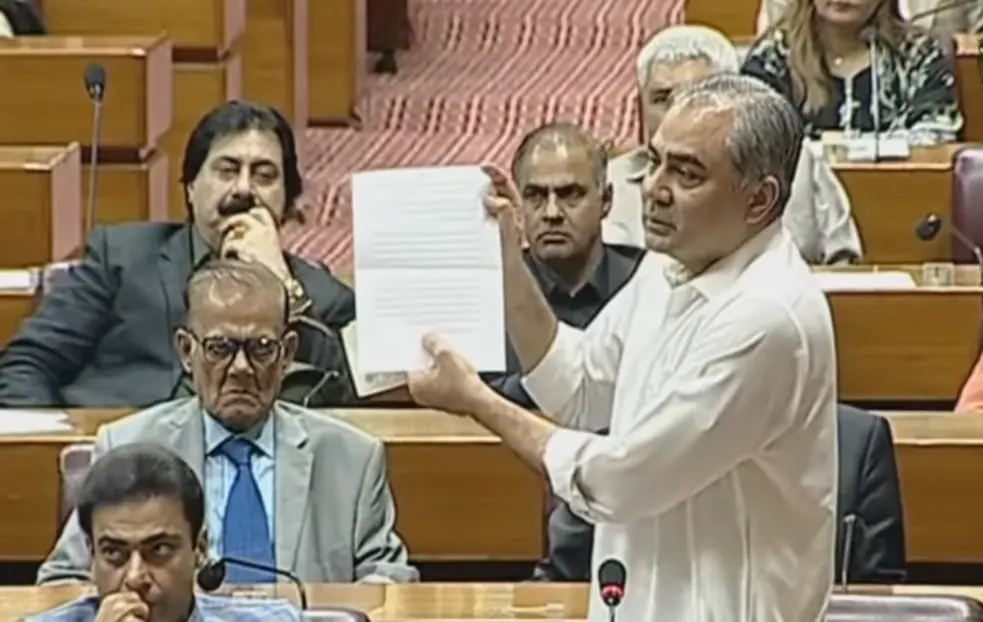Interior Minister Mohsin Naqvi holds a paper during a joint sitting of Parliament on Thursday. — screengrab via DawnNewsTV