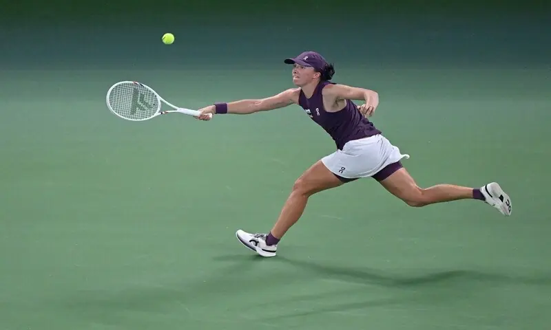 Poland’s Iga Swiatek stretches for a return against Ashlyn Krueger of the US during their Wuhan Open round-of-16 match at the Dongfeng Voyah Centre Court in Wuhan, China, on October 15, 2026. —AFP Poland’s Iga Swiatek stretches for a return against Ashlyn Krueger of the US during their Wuhan Open round-of-16 match at the Dongfeng Voyah Centre Court in Wuhan, China, on October 15, 2026. —AFP