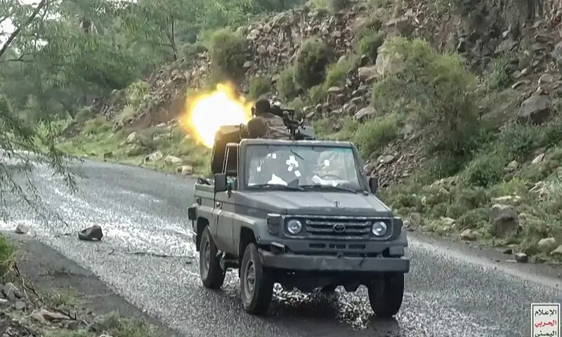 This screen grab taken from video footage released by Ansarullah Media Centre on October 7 shows a fighter affiliated with the Houthi authorities firing a truck-mounted machine gun as they advance against Saudi-backed Yemeni government troops in Taiz Governorate, according to Houthi media.— AFP