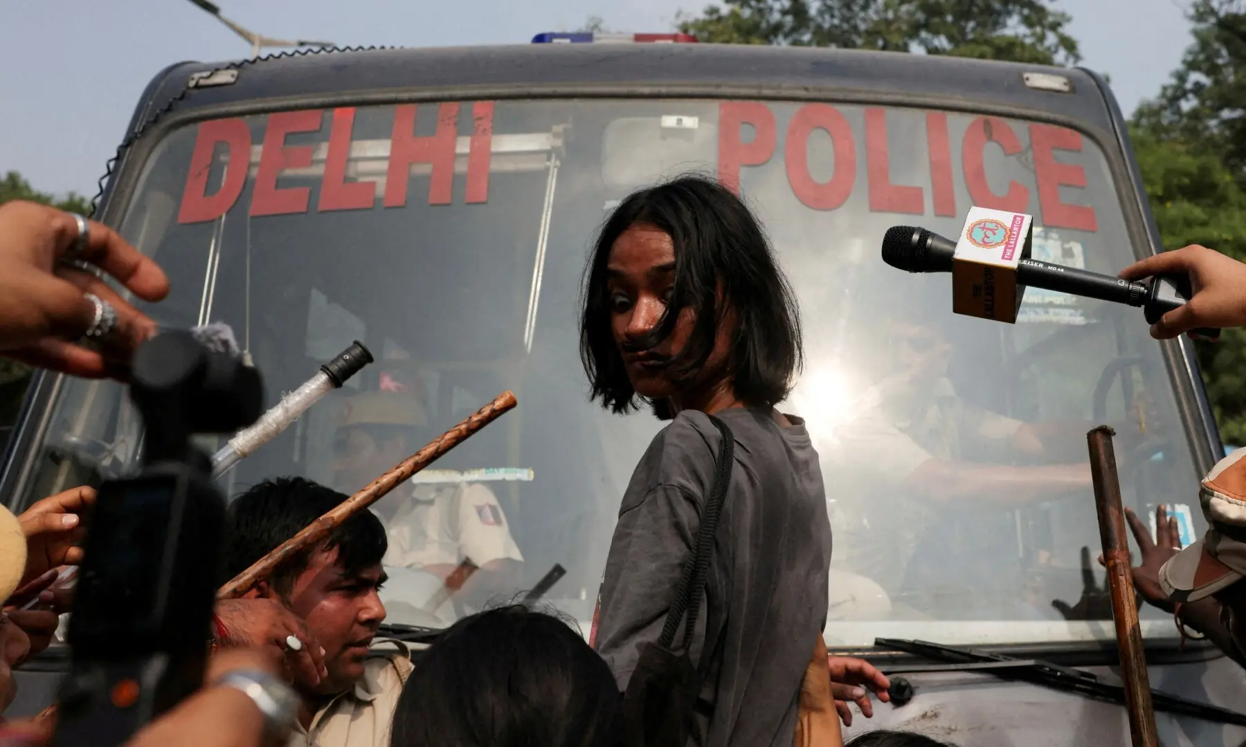 Ananya Raturi, 21, reacts as she tries to stop the police bus carrying detained protesters during a protest organised by the Cockroach Janta Party (CJP), seeking the resignation of India’s Chief Election Commissioner, Gyanesh Kumar, in New Delhi, India on October 10, 2026. —Reuters/File