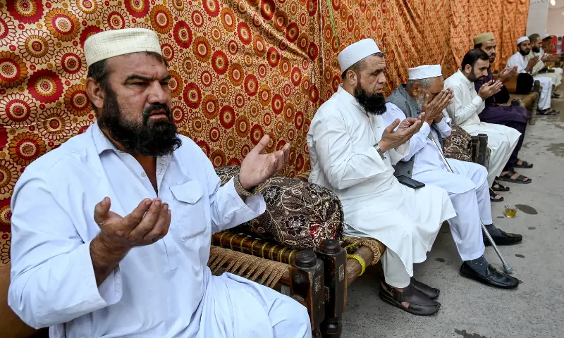 People pray for students killed after a roof collapsed at a school, in Peshawar on October 16, 2026. — AFP People pray for students killed after a roof collapsed at a school, in Peshawar on October 16, 2026. — AFP