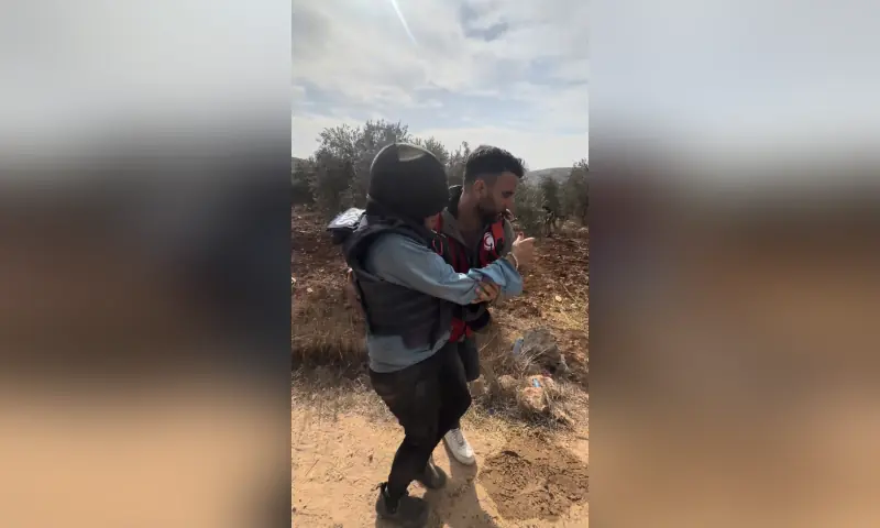 A journalist is helped after being attacked by Israeli settlers in Abu Falah, West Bank on October 16, 2026, in this screengrab from a video. — via Reuters A journalist is helped after being attacked by Israeli settlers in Abu Falah, West Bank on October 16, 2026, in this screengrab from a video. — via Reuters