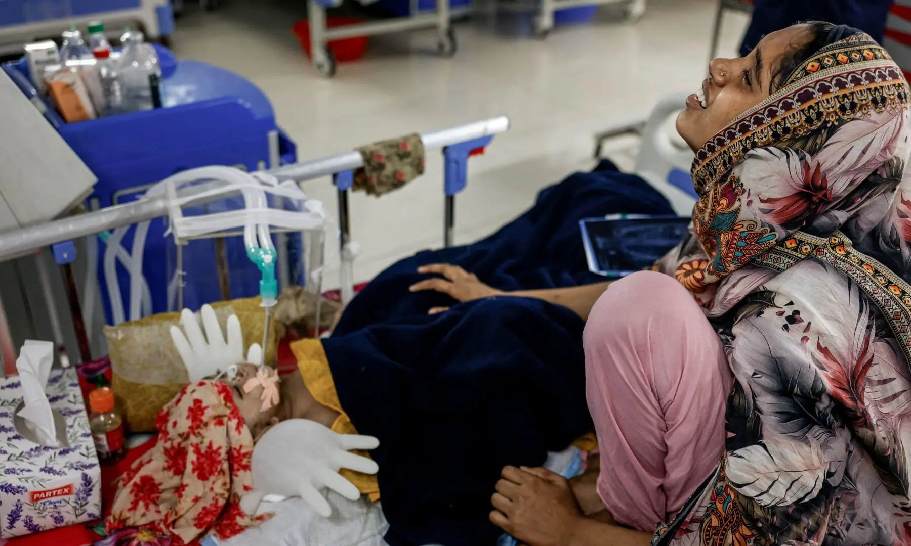 Urmi, 19, mourns as her 11-month-old son, Mohammad, deteriorates while receiving treatment in the neonatal intensive care unit (NICU) of a hospital in Narayanganj, Bangladesh, May 11, 2026. —Reuters