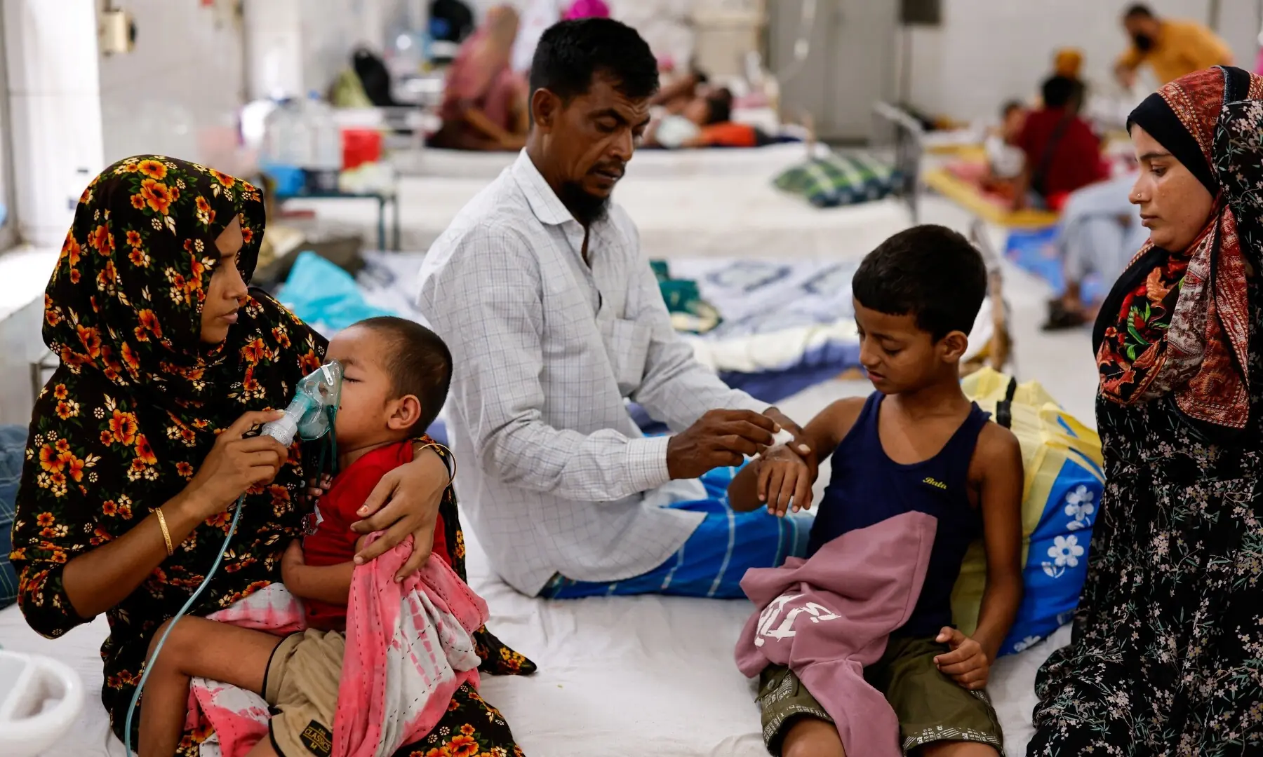 Bilkis and other parents take care of their children receiving treatment at the overcrowded measles isolation ward of Shahid Shamsuddin Ahmed Hospital after developing symptoms of measles, in Sylhet, Bangladesh, September 12, 2026. —Reuters
