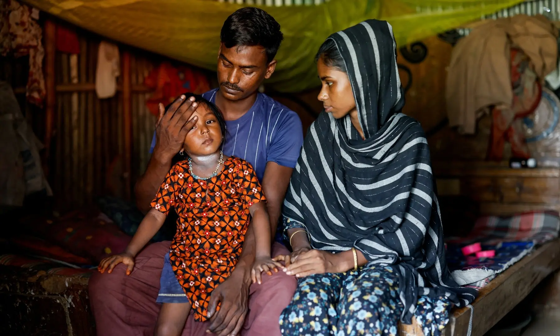 Amin Mia, 26, and Sajina Begum, 27, adore their four-year-old daughter Fatima, after losing their 34-month-old son, Arman Hossain, to suspected measles during a recent deadly outbreak, in Sunamganj, Bangladesh, September 15, 2026. —Reuters