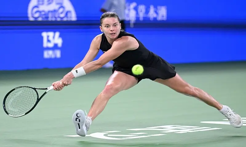 Poland's Maja Chwalinska stretches for a return against Poland's Iga Swiatek during their Wuhan Open semi-final at the Optics Valley International Tennis Centre in Wuhan, China, on October 17, 2026. &mdash;AFP